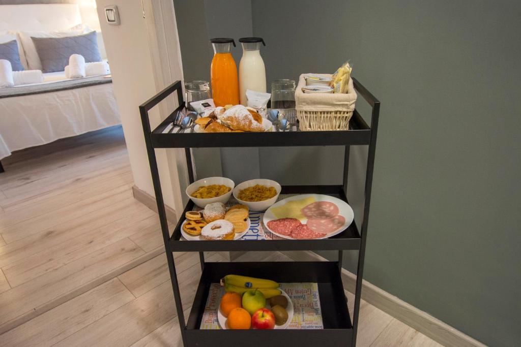 a shelf filled with different types of food at Luxury Boutique Hotel in Rome