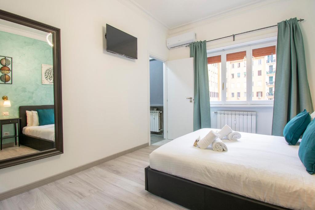 a bedroom with a large mirror and a bed at Luxury Boutique Hotel in Rome