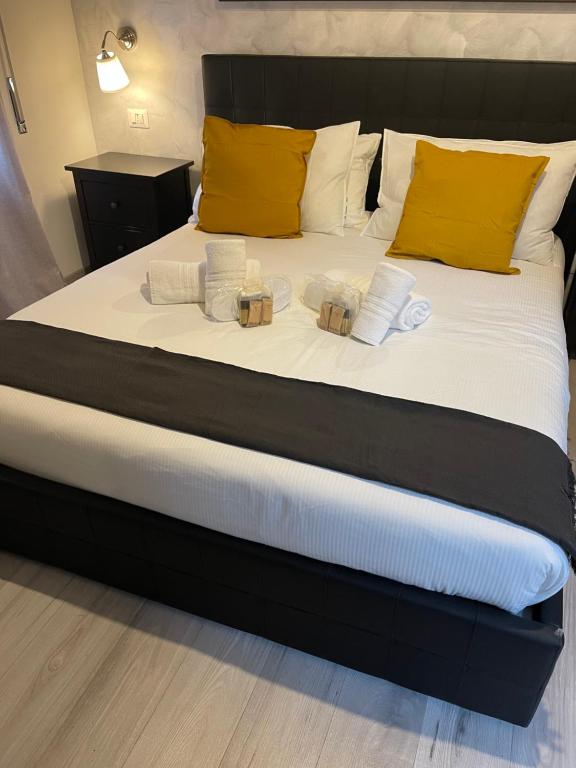 a bedroom with a bed with two candles on it at Luxury Boutique Hotel in Rome