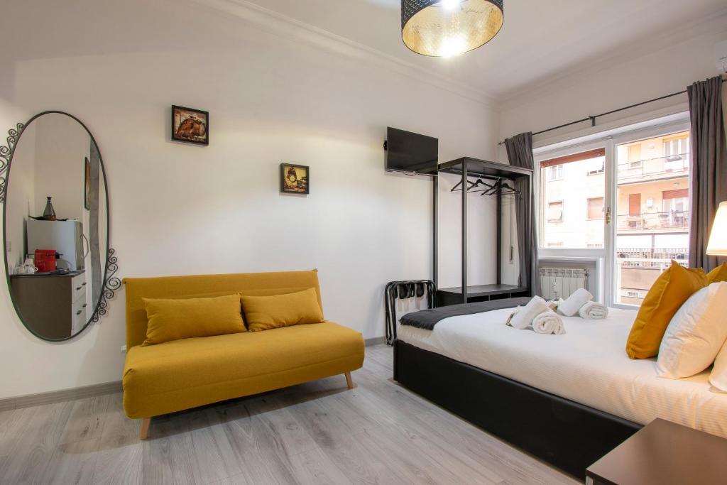 a bedroom with a bed and a yellow chair at Luxury Boutique Hotel in Rome