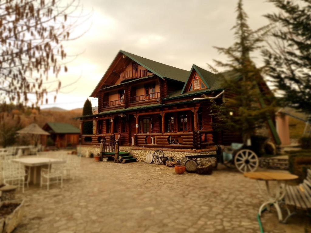 a model of a wooden house on a stone road at Sofra Kolonjare Agroturizem in Ersekë