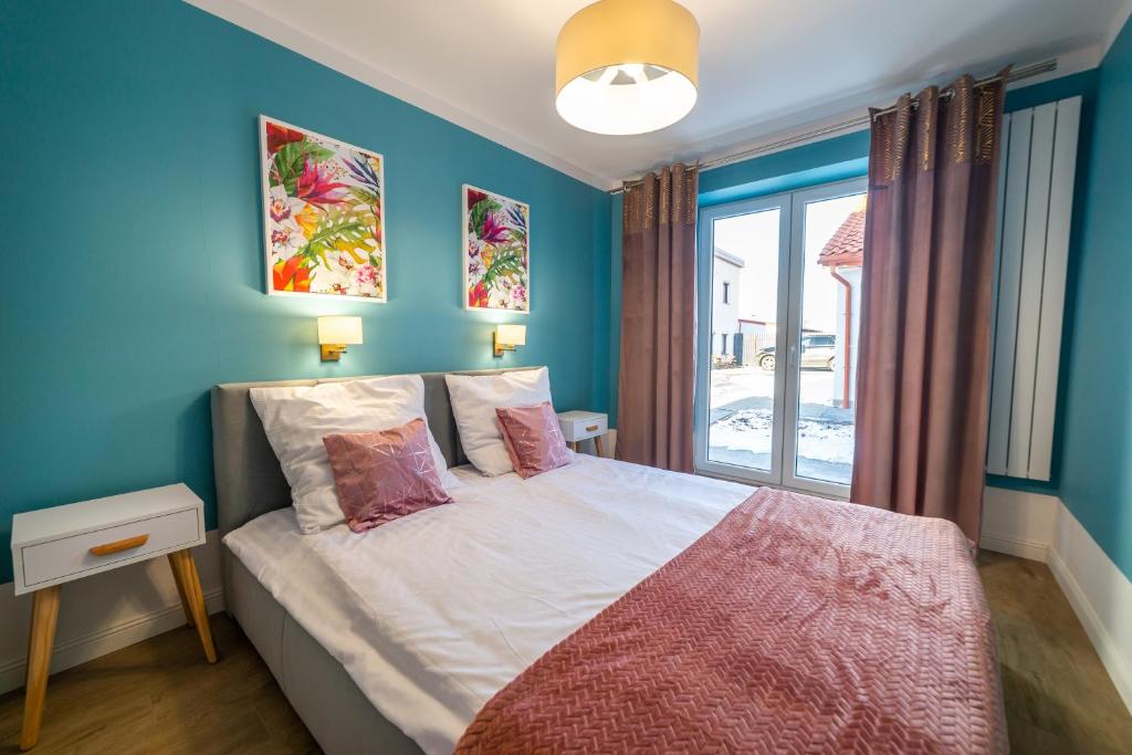 Posteľ alebo postele v izbe v ubytovaní Lawendowe wzgórze Apartamenty