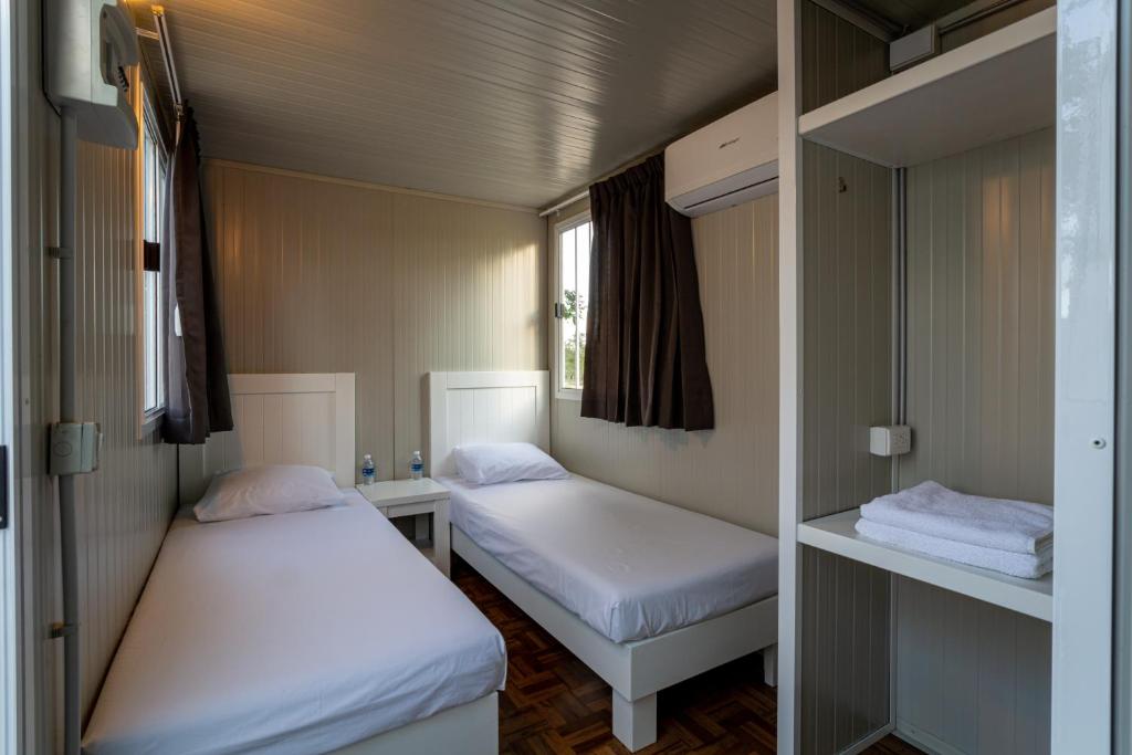 Ένα ή περισσότερα κρεβάτια σε δωμάτιο στο Xuux Peek by Tecnohotel