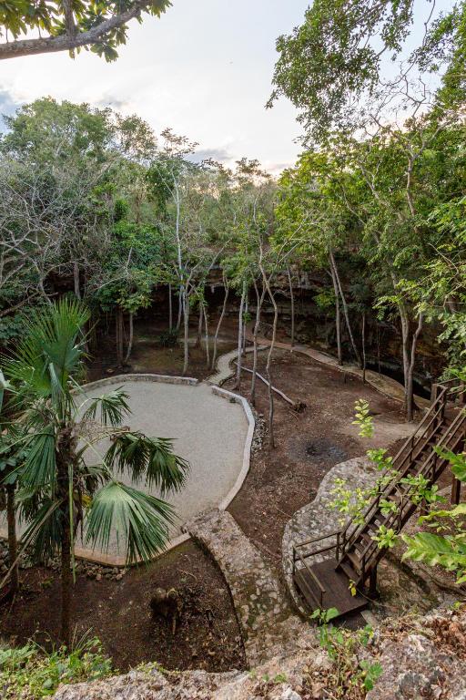 Um jardim em Xuux Peek by Tecnohotel