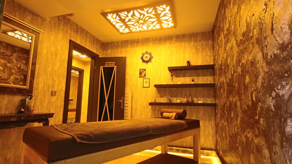 Postel nebo postele na pokoji v ubytování koza millenyum hotel&spa