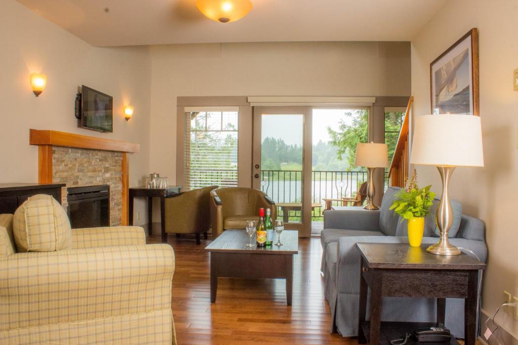 a living room with a couch and a fireplace at The Cottages on Salt Spring Island in Ganges