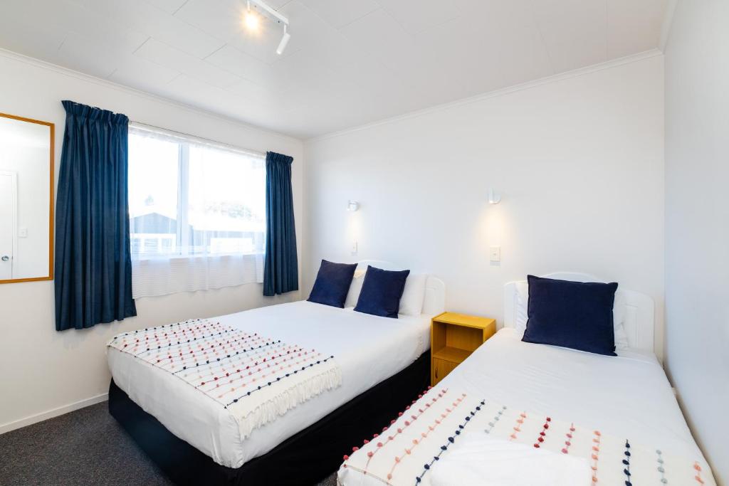 Postel nebo postele na pokoji v ubytování Chevron Motel