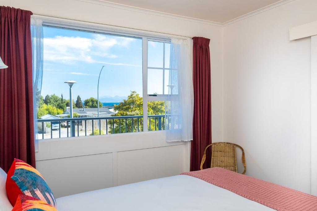Postel nebo postele na pokoji v ubytování Chevron Motel