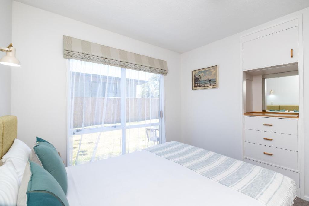 Postel nebo postele na pokoji v ubytování Chevron Motel
