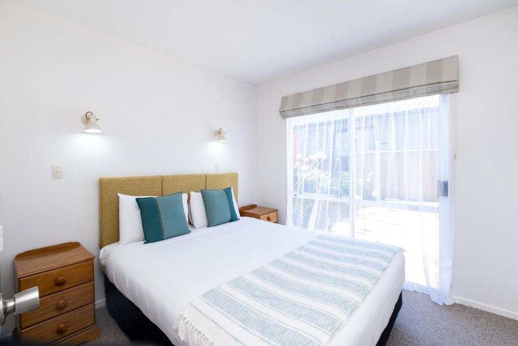 Postel nebo postele na pokoji v ubytování Chevron Motel