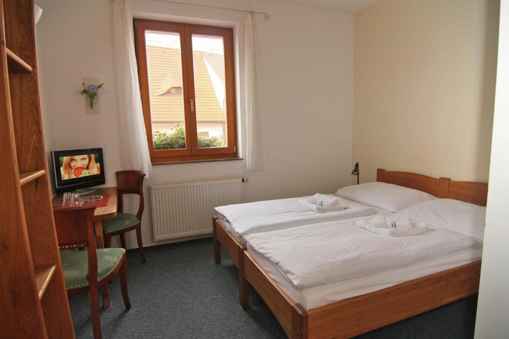 Postel nebo postele na pokoji v ubytování Hotel Klika