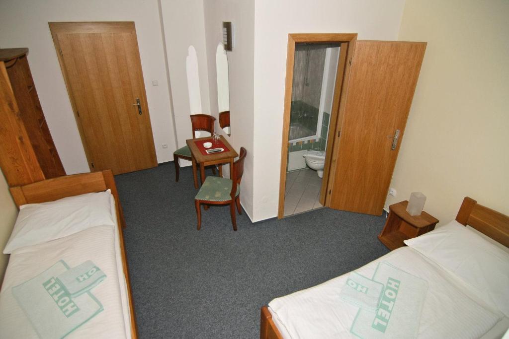 Postel nebo postele na pokoji v ubytování Hotel Klika