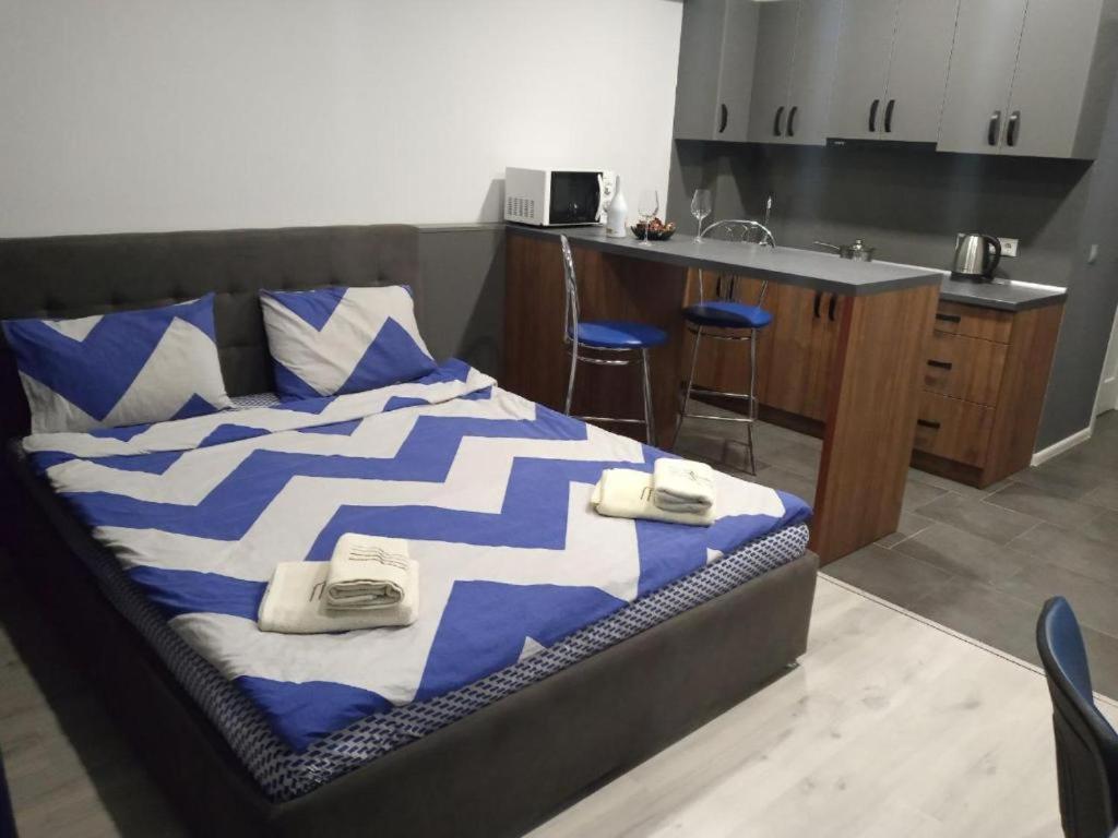 Cama ou camas em um quarto em АпартаментиTrembita