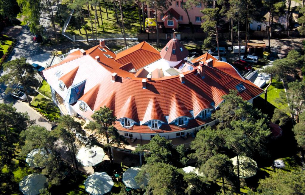 an overhead view of a house with an orange roof at Chimera Spa Niechorze in Niechorze