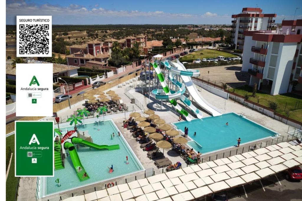 an aerial view of a water park with two pools at Ohtels Carabela in Matalascañas