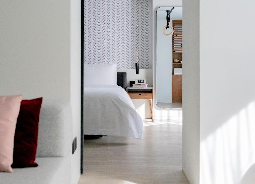 Postel nebo postele na pokoji v ubytování Stey Beijing Wangfujing Hotel