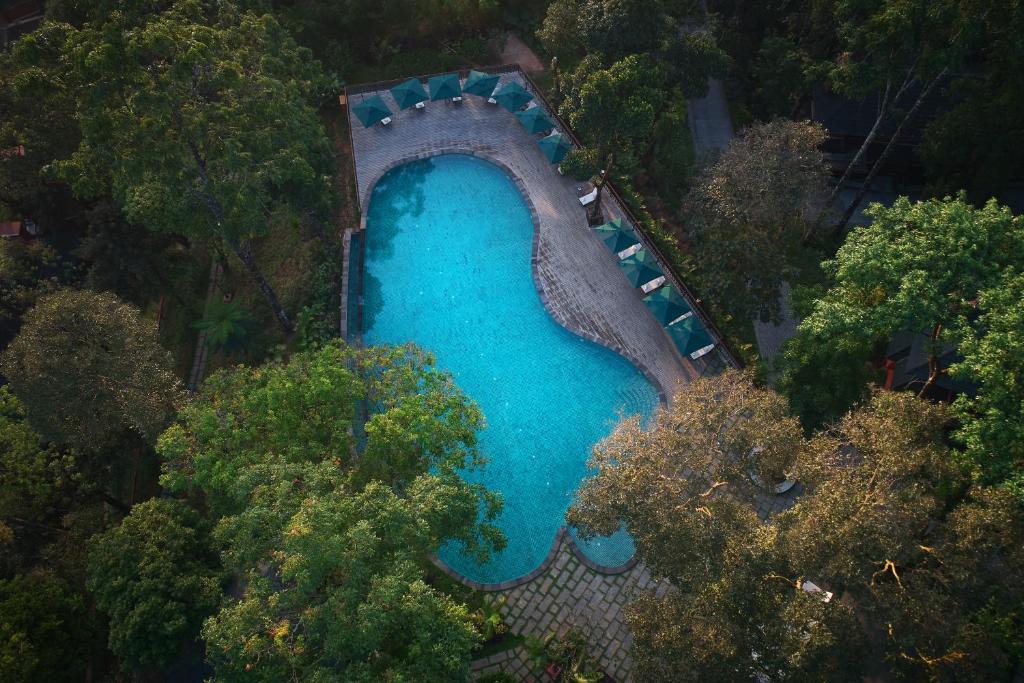Bazén v ubytování Coorg Wilderness Resort & Spa nebo v jeho okolí