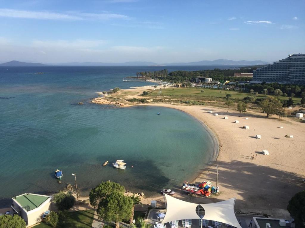 an aerial view of a beach with boats in the water at DİDİM Ege Apart in Didim