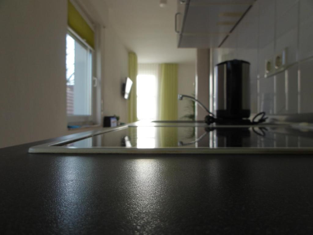 a kitchen with a counter top with a coffee maker at Pension Zeitlos in Potsdam