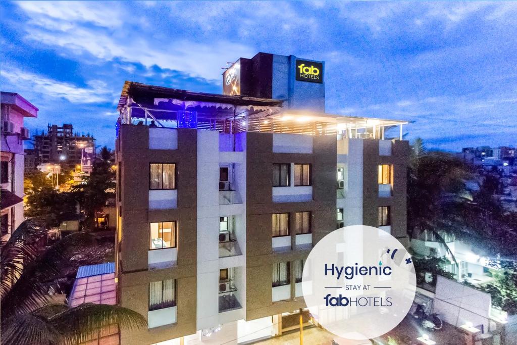a building with a sign on top of it at FabHotel Imperio - Nr Baner Hill in Pune