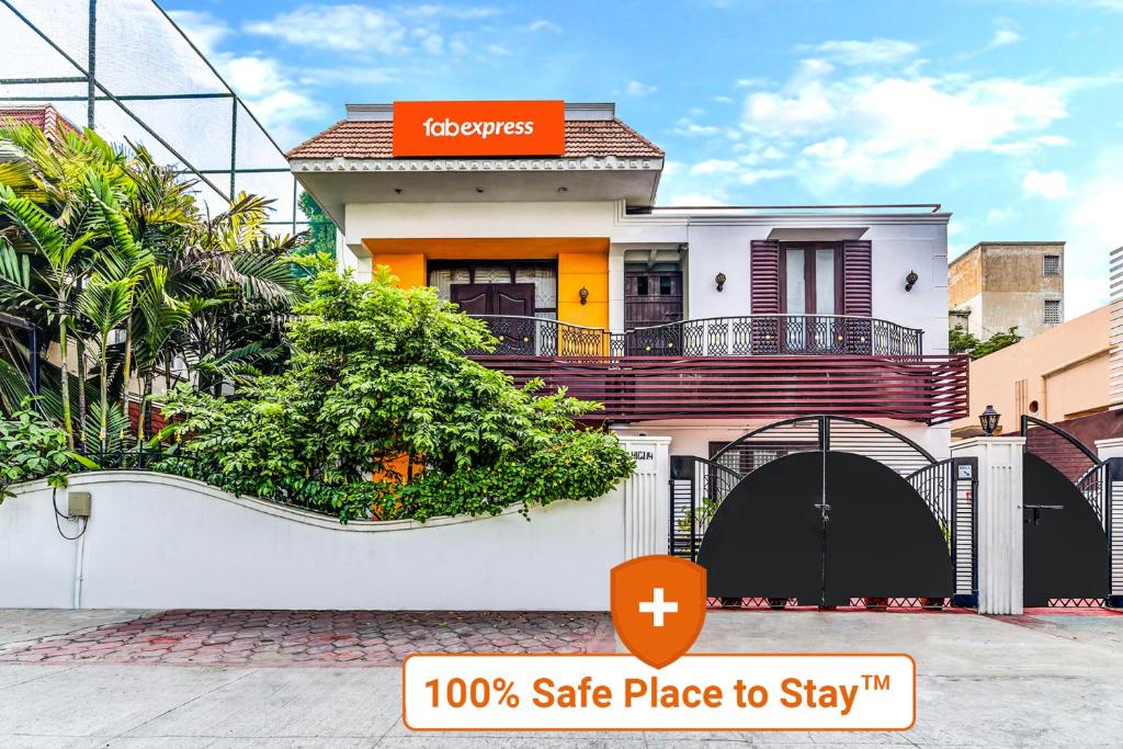 a house with a safe place to stay sign on it at Fab Express Nestlay Rooms - Nr Ambattur Railway Station in Chennai