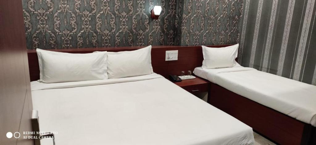 Postel nebo postele na pokoji v ubytování HOTEL PARK VICTORIA
