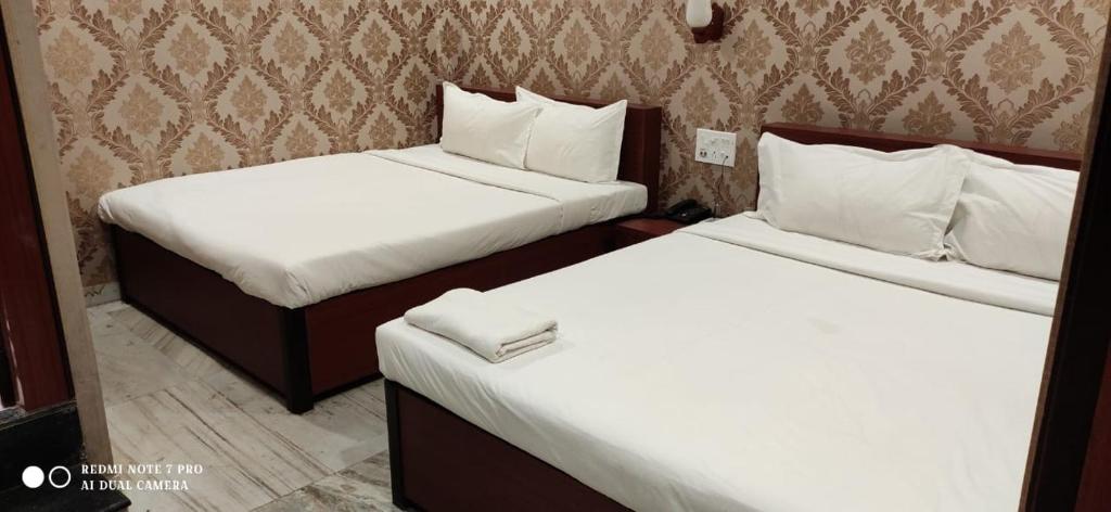 Postel nebo postele na pokoji v ubytování HOTEL PARK VICTORIA