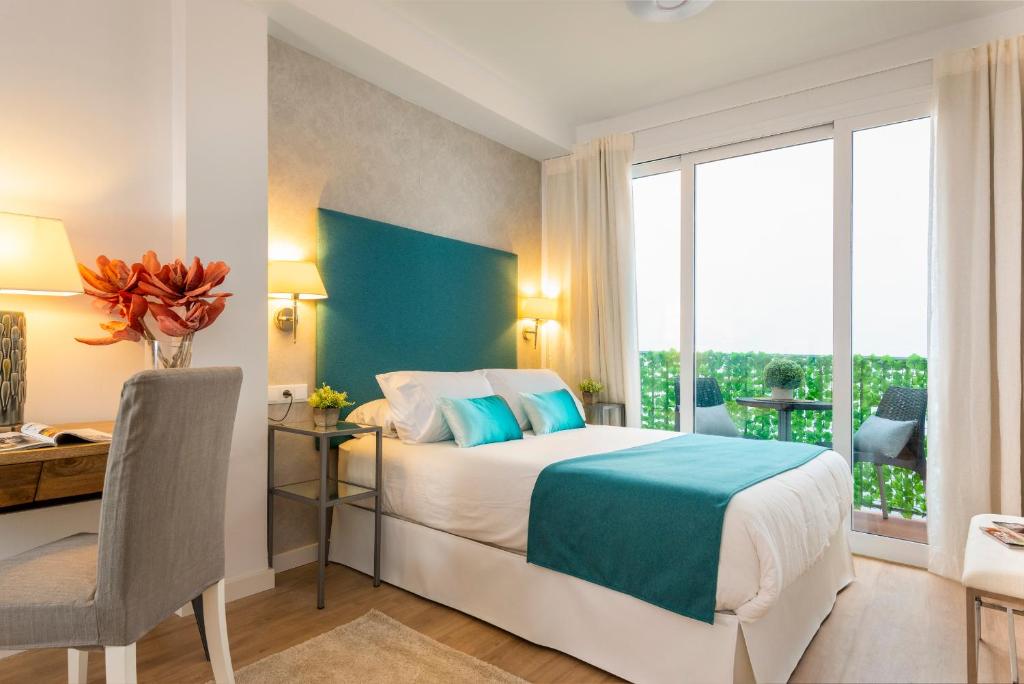 Posteľ alebo postele v izbe v ubytovaní Genteel Home Baños