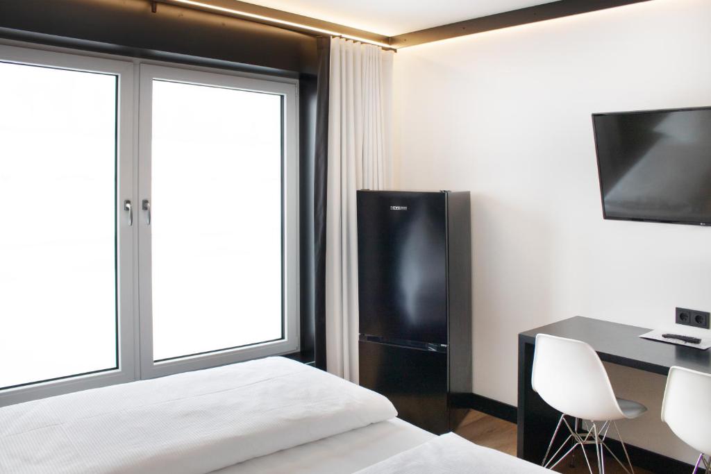 TV a/nebo společenská místnost v ubytování BI Hotel by WMM Hotels