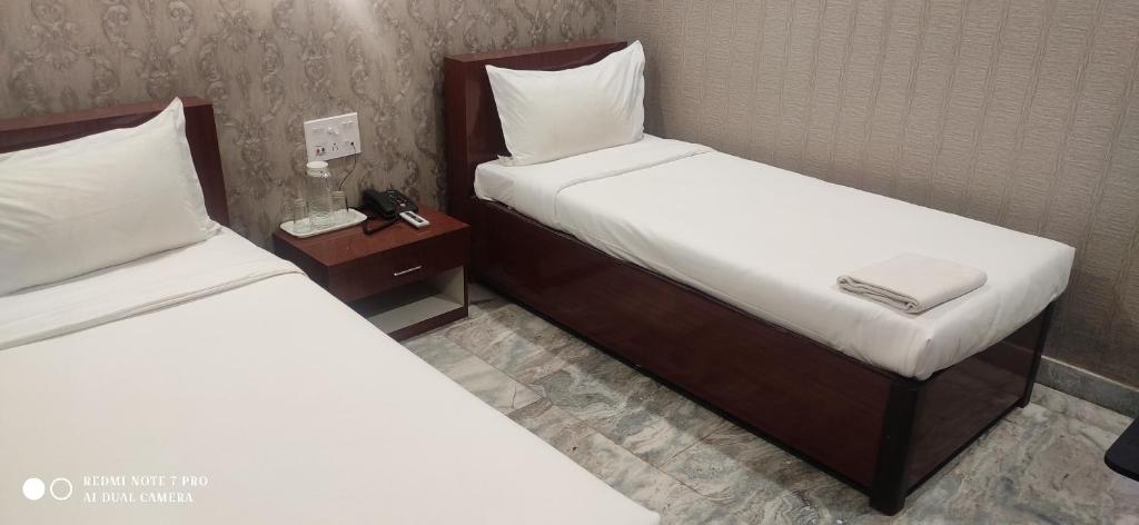 Postel nebo postele na pokoji v ubytování HOTEL PARK VICTORIA