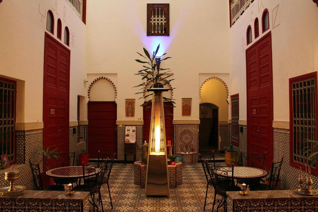 a large room with a large clock on the wall at Riad Meftaha in Rabat