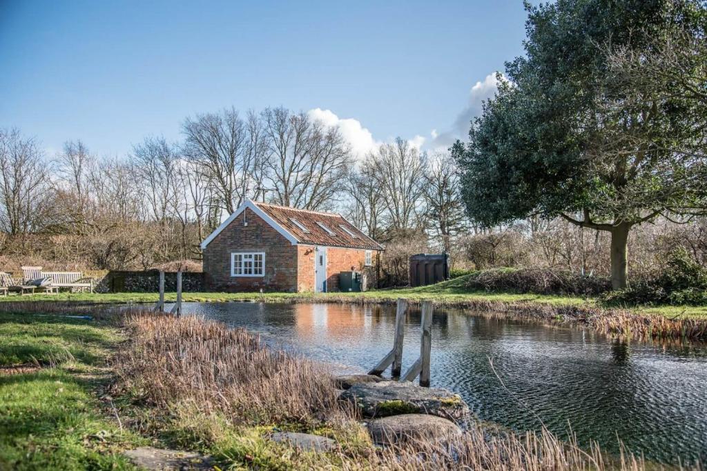 a house in the middle of a river at Mill Cottage, Tunstall in Tunstall