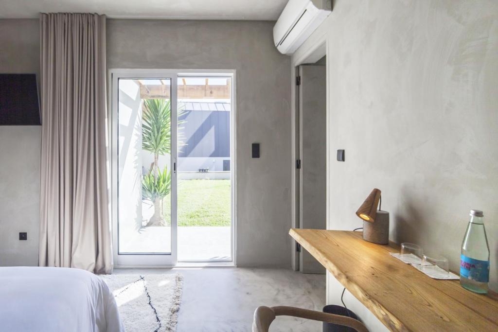 Postel nebo postele na pokoji v ubytování CASA DA ILHA - Slow Living Residence & Suites