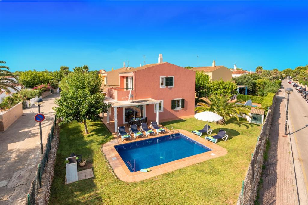 an aerial view of a house with a swimming pool at Villas Nura in Son Carrio