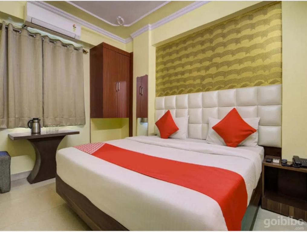 מיטה או מיטות בחדר ב-HOTEL GARDEN VILLA