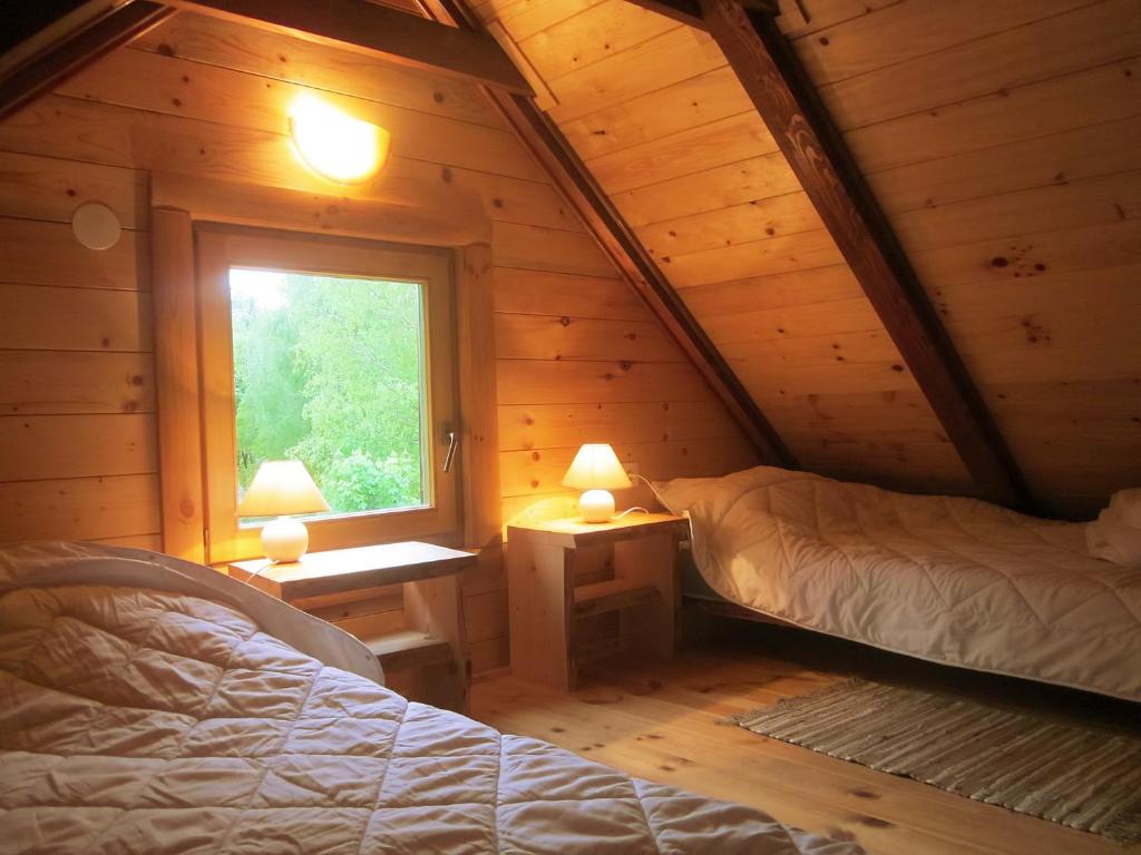 Postel nebo postele na pokoji v ubytování Chalets Zelena Vrata