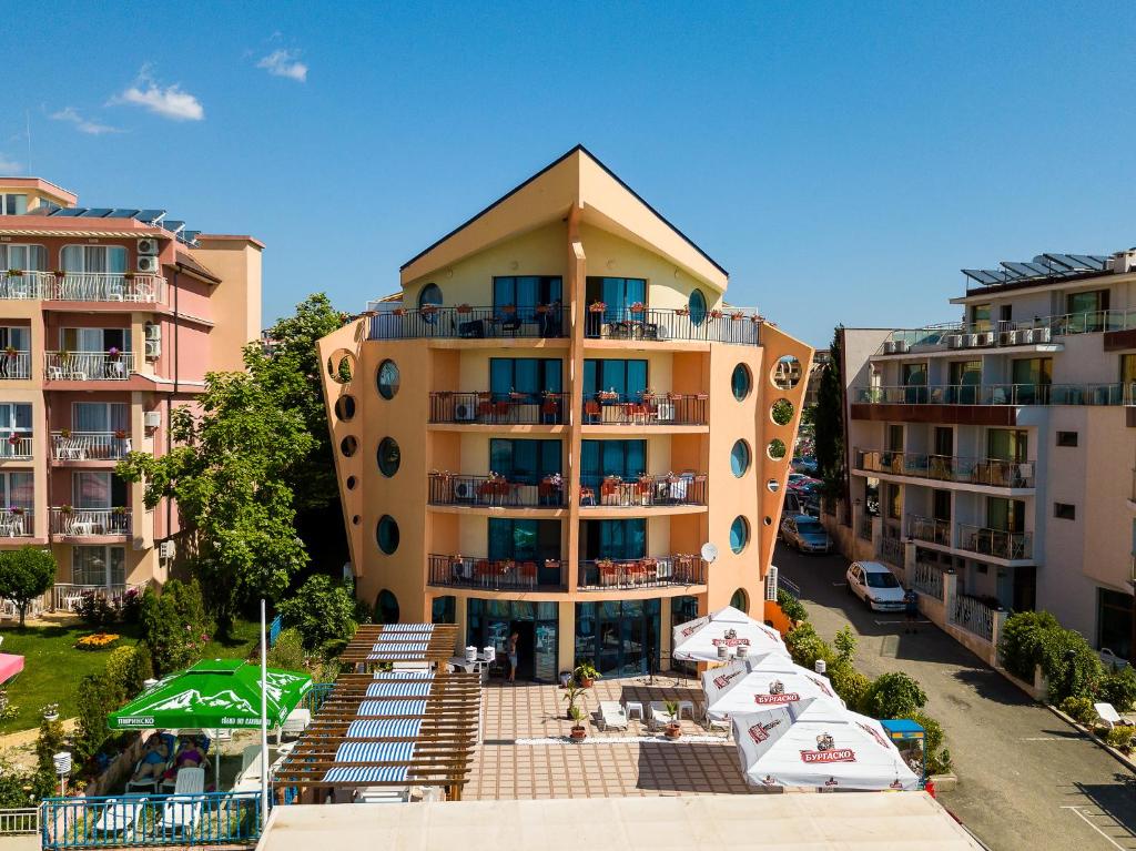 a large apartment building with a balcony on it at Hotel Evridika in Nesebar