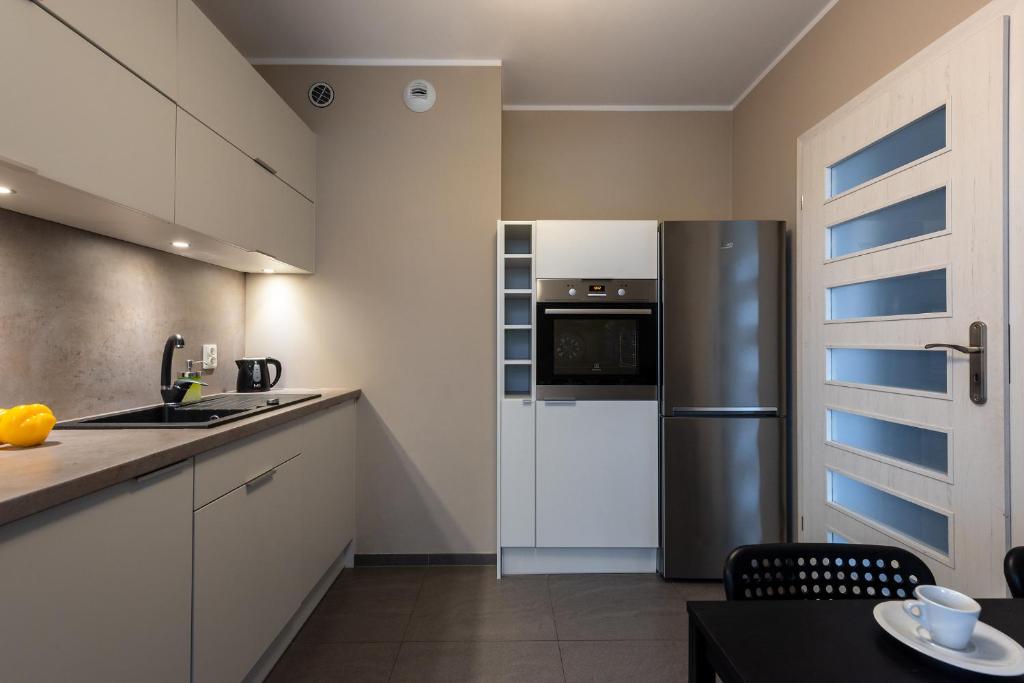 Kuchyňa alebo kuchynka v ubytovaní apartamenty-wroc Atal Towers