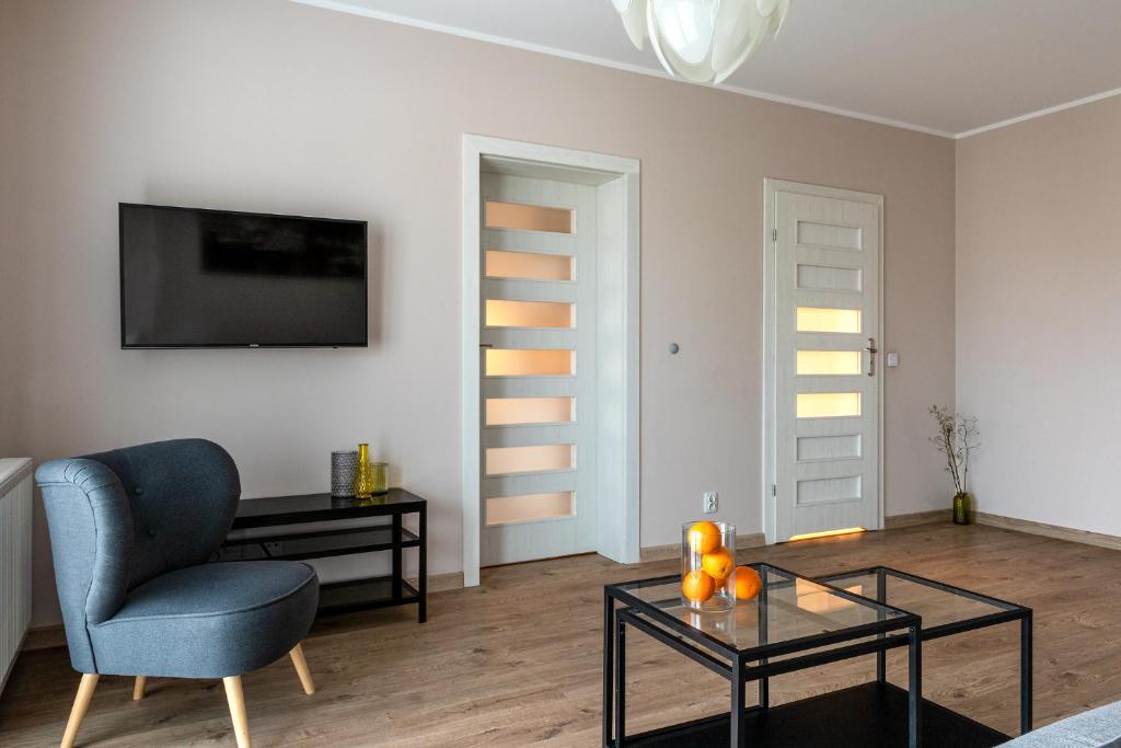 Televízia a/alebo spoločenská miestnosť v ubytovaní apartamenty-wroc Atal Towers