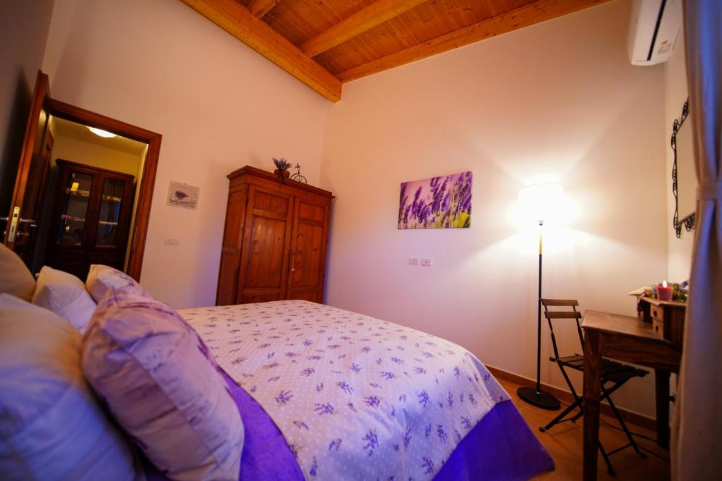 Postel nebo postele na pokoji v ubytování Fonte Murata B&B