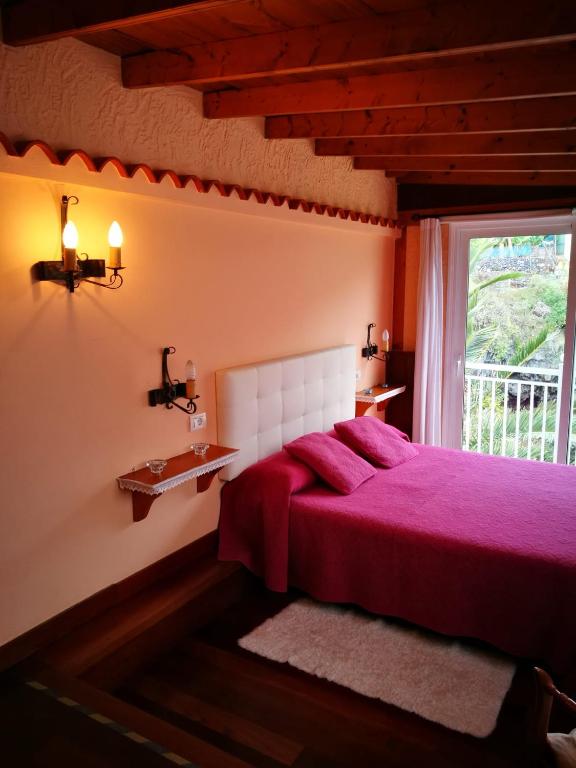 Posteľ alebo postele v izbe v ubytovaní Charming House in Buenavista del Norte with Shared Pool