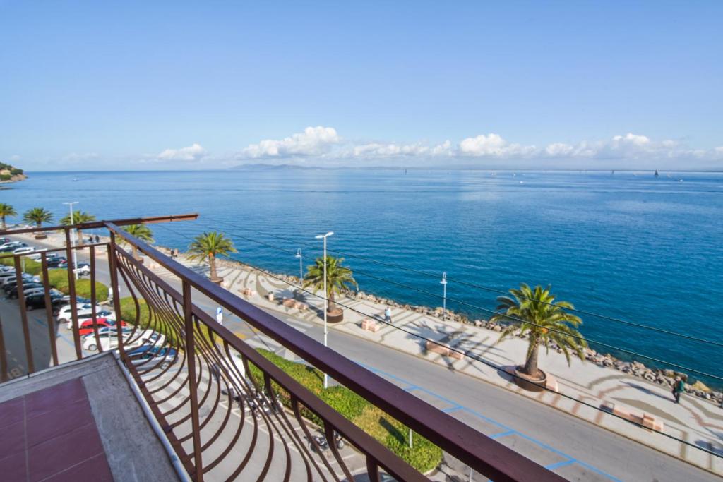 a view of the ocean from a balcony at Apartment with balcony in Porto Santo Stefano 89 m² sea view in Porto Santo Stefano