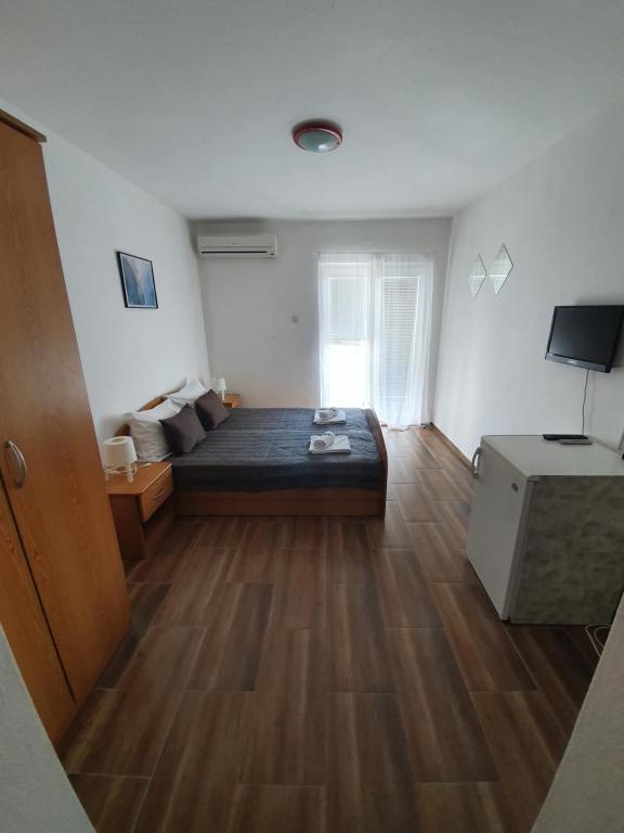 TV a/nebo společenská místnost v ubytování Guesthouse Dupin