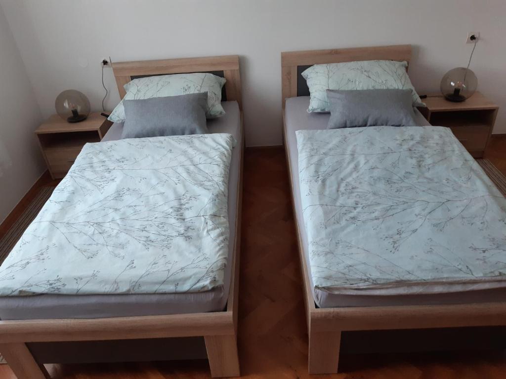 Postel nebo postele na pokoji v ubytování Apartman Helena