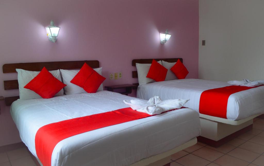 Postel nebo postele na pokoji v ubytování Hotel Kashlan Palenque