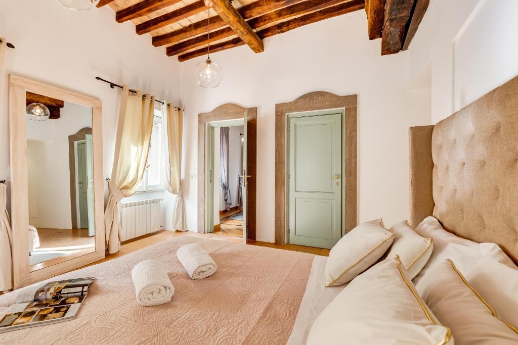 Posteľ alebo postele v izbe v ubytovaní NAVONA SQUARE - RomeDreamHome