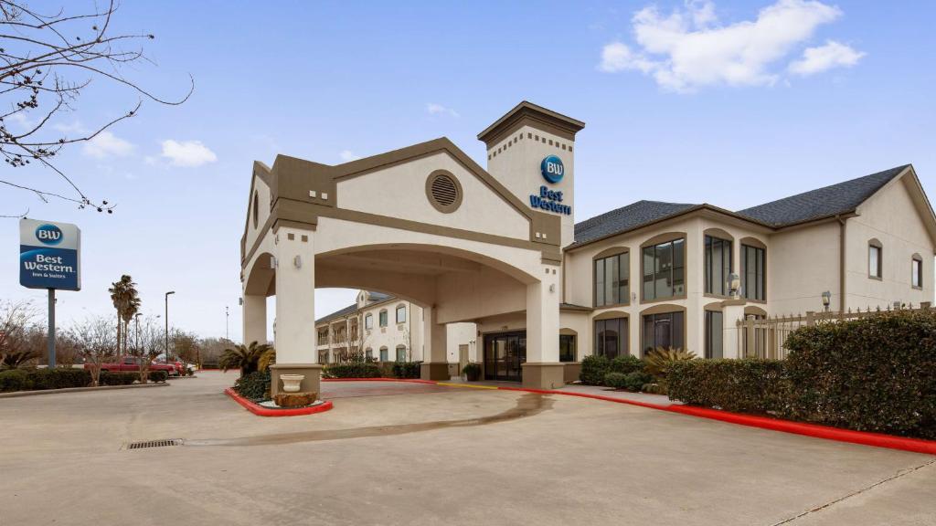 a large white building with an arch in front of it at Best Western Dayton Inn & Suites in Dayton