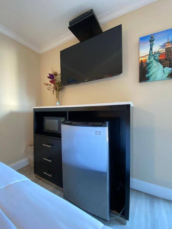 TV a/nebo společenská místnost v ubytování Relax Inn North Babylon
