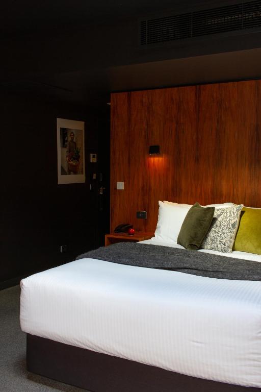 Postel nebo postele na pokoji v ubytování Moss Hotel