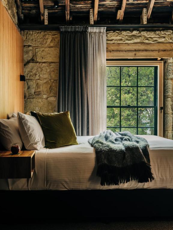Postel nebo postele na pokoji v ubytování Moss Hotel